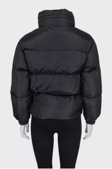 Black down jacket with zip pockets and tag