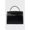 Black satchel bag with embossed leather