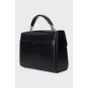 Black satchel bag with embossed leather