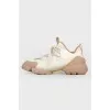 White-brown sneakers on laces