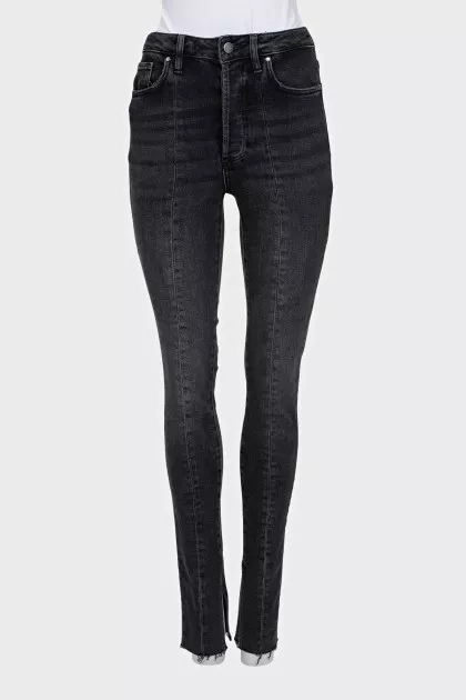 Black jeans decorated with slits