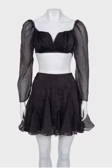 A crop top and mini skirt outfit