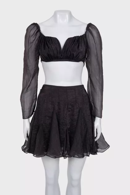 A crop top and mini skirt outfit