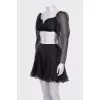 A crop top and mini skirt outfit