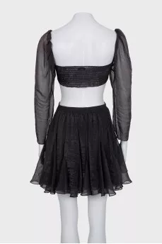 A crop top and mini skirt outfit
