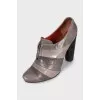 Brown leather ankle boots with a zipper