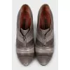 Brown leather ankle boots with a zipper