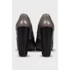 Brown leather ankle boots with a zipper