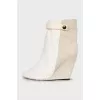 Suede ankle boots with a zipper and a wedge heel