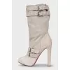 Suede boots decorated with python skin