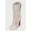 Suede boots decorated with python skin