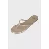 Golden leather flip flops