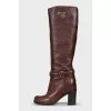 Brown leather boots with brand logo