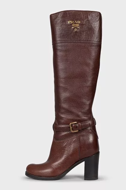 Brown leather boots with brand logo