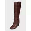 Brown leather boots with brand logo