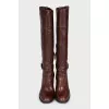 Brown leather boots with brand logo