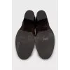 Brown leather boots with brand logo