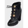 Black ankle boots with massive decor