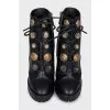 Black ankle boots with massive decor