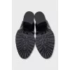 Black ankle boots with massive decor