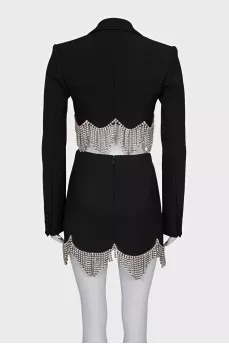 A suit consisting of a cropped jacket and a crystal-embellished skirt