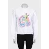 White sweatshirt with bright embroidery