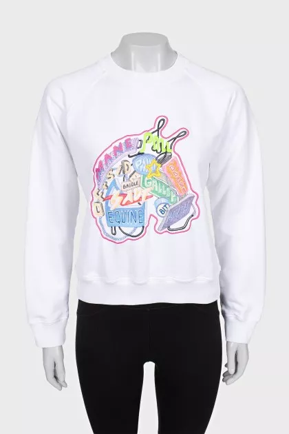 White sweatshirt with bright embroidery