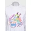 White sweatshirt with bright embroidery