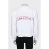 White sweatshirt with bright embroidery