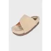 Fur slippers with leather insert