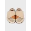 Fur slippers with leather insert