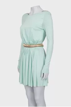 Fitted dress with a gold belt