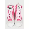High-top sneakers with pink accents
