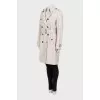 Double-breasted trench coat with buckles