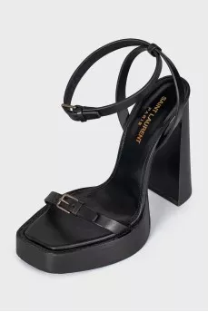 Leather sandals with high soles and heels