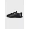 Black leather lace-up sneakers