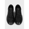 Black leather lace-up sneakers