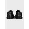 Black leather lace-up sneakers