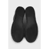 Black leather lace-up sneakers