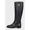 Black leather boots with metallic decor