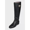 Black leather boots with metallic decor