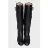 Black leather boots with metallic decor