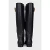Black leather boots with metallic decor