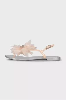 Silver sandals decorated with a flower