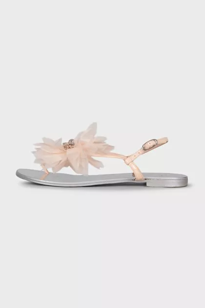 Silver sandals decorated with a flower
