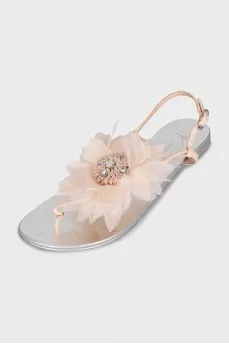 Silver sandals decorated with a flower