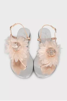 Silver sandals decorated with a flower