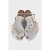 Silver sandals decorated with a flower