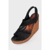 Suede sandals with a cork wedge heel
