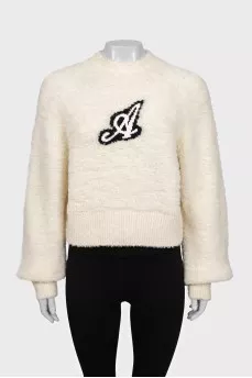Beige sweater with a patch
